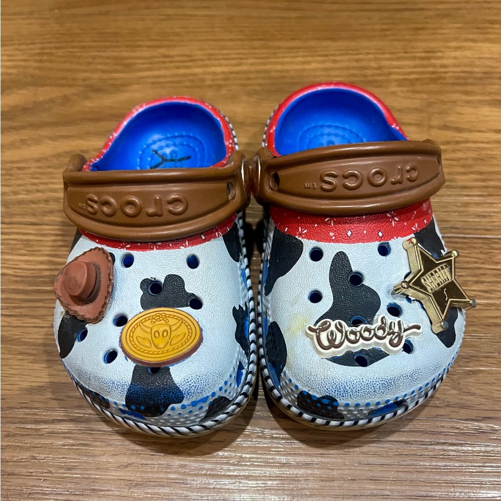 CROCS Kids Woody Cow Print Clogs in White, Black & Brown